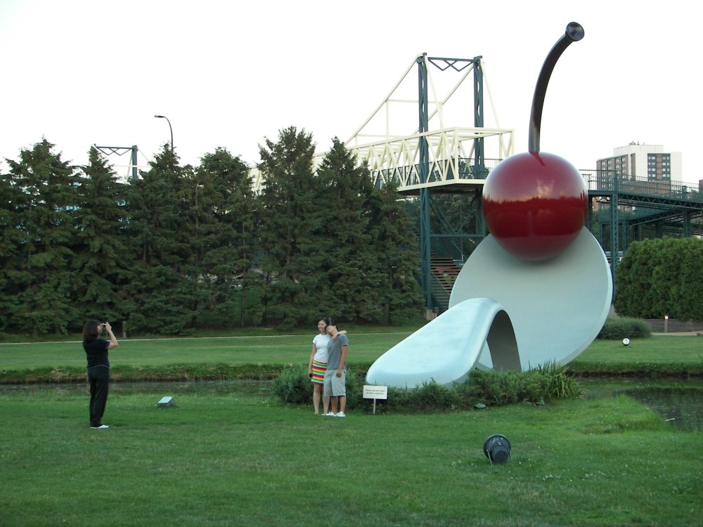 Couple posing in front of Spoonbridge and Cherry